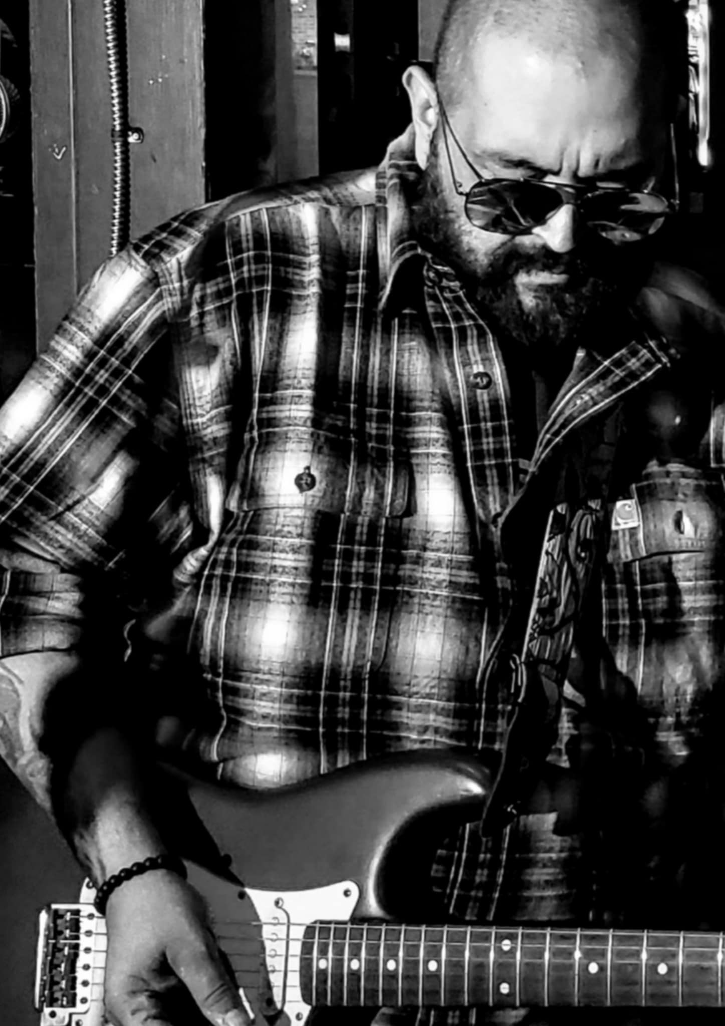 Jon Qcountry playing guitar